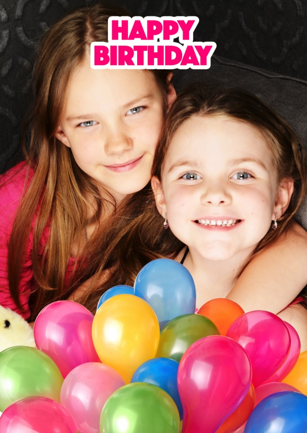 Happy birthday in pinker Schrift mit knallbunten Luftballons unten im Bild