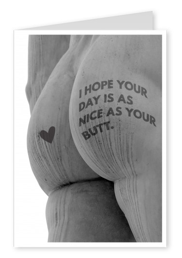 Statue's naked butt with saying and heart printed on