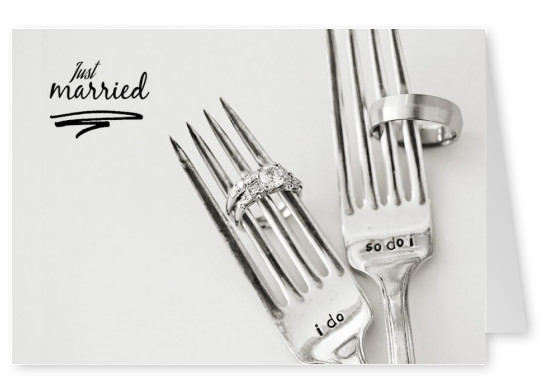 two forks with wedding rings