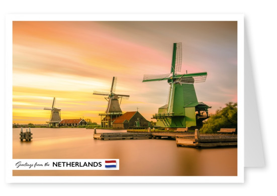 Photo of a windmill near water in the Netherlands–mypostcard