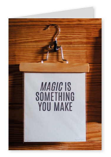 coat hook that holds a sign saying magic is something you make