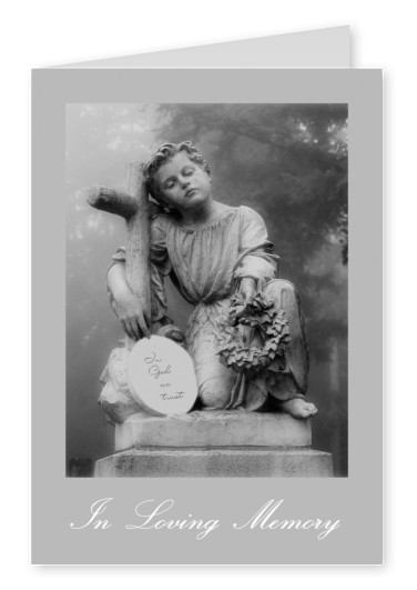 photo statue boy with cross