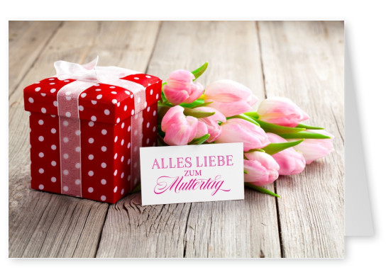 Geschenk in gepuntetem Papier mit Karte und rosa Tulpen zum Muttertag