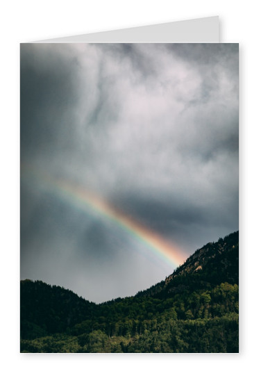 Fotografie mit Bergen und Regenbogen