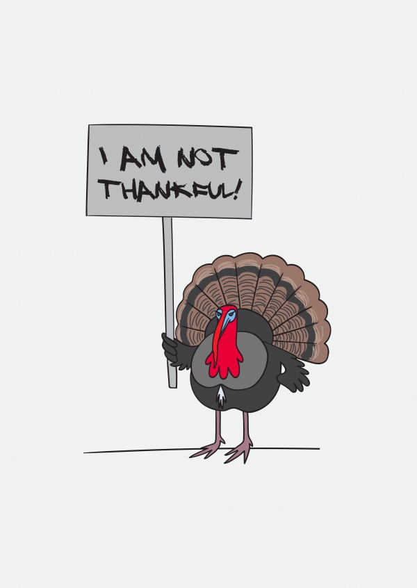 Not thankful. Turkey holding a handwritten sign.