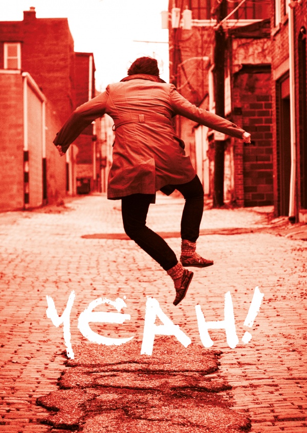 Photo of a jumping guy in the street in red