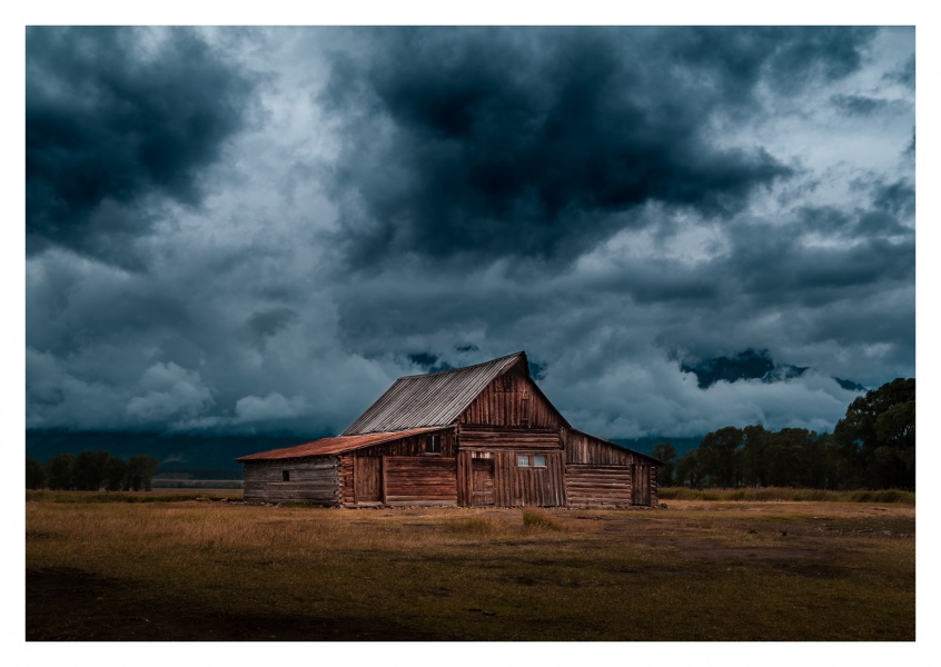 mysterious wooden cabin in the middle of nowhere with cloudy sky