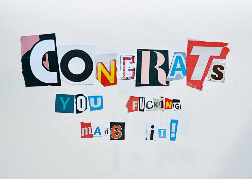 colourful newspaper snippets that make up the message congrats you f*cking made it