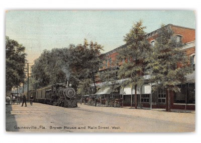 Gainesville Florida Train Passing Brown House and Main Street