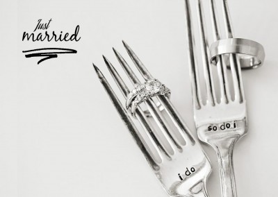 two forks with wedding rings