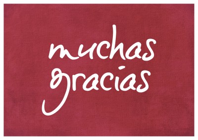 Muchas gracias in white handwriting on red carpet textureâ€“mypostcard