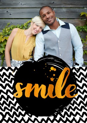 smile in yellow handlettering with black and white zigzag pattern as background