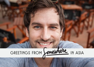 Greetings from Somewhere in Asia black text on grey rectangle